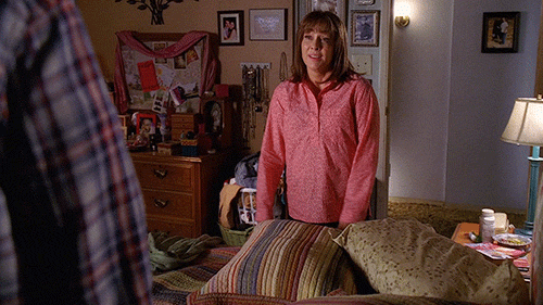 GIF mother falling on her bed